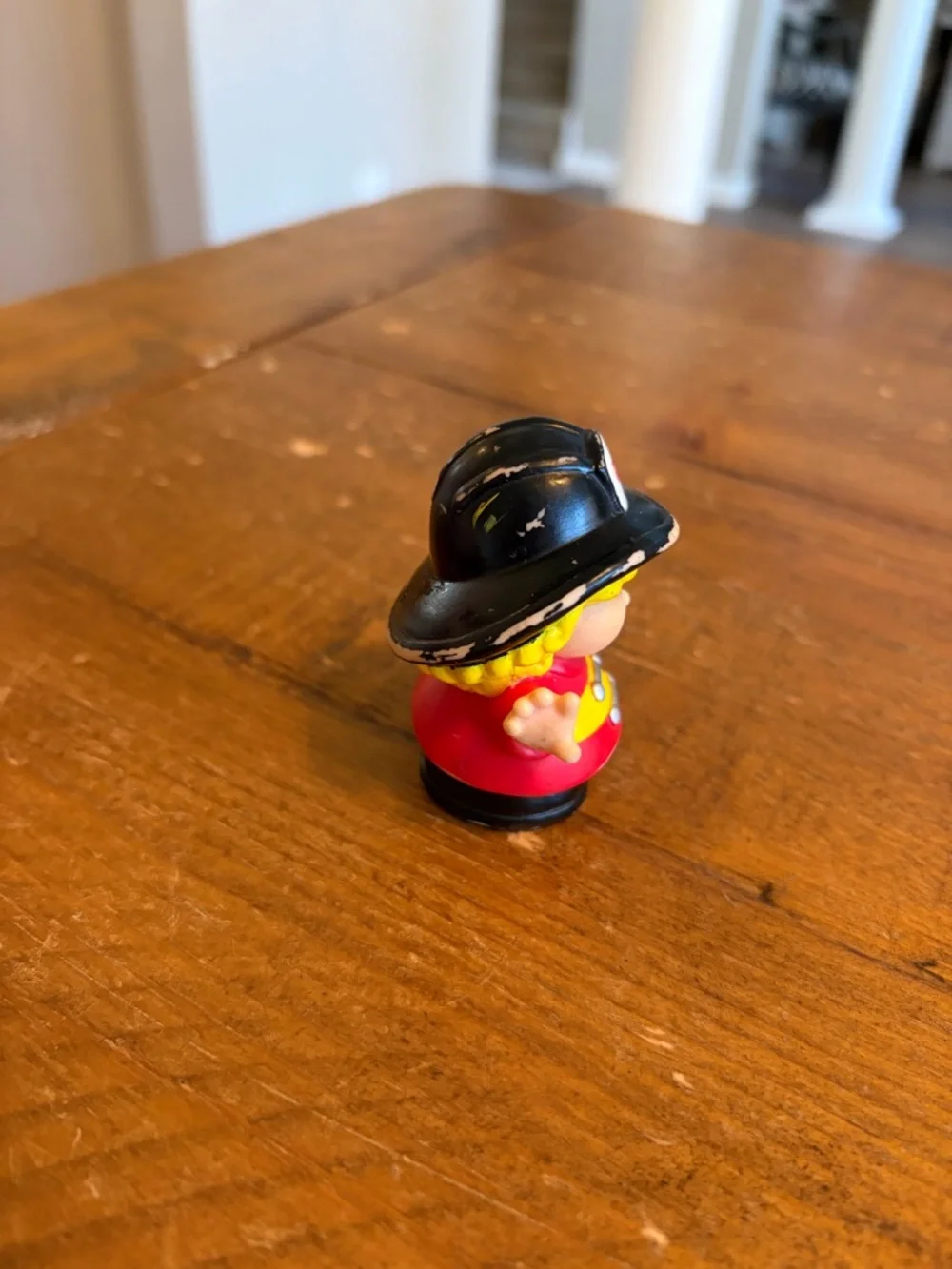 Fisher Price Little People firefighter as is. Has paint wear around hat